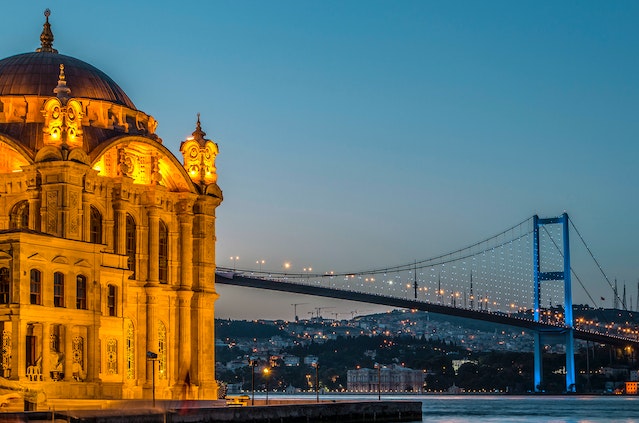 A traveler's guidebook opened to a page with Atlanta to Istanbul travel tips