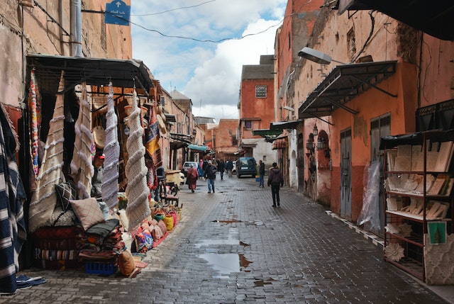 A traveler referencing a guidebook with tips for a journey from Atlanta to Marrakech.